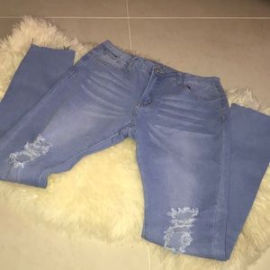 Distressed stretch high rise jeans
